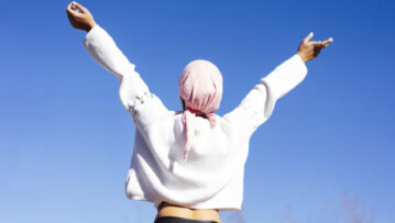 woman with pink headscarf, has cancer